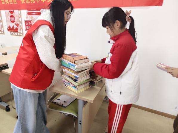 D:/Desktop/2026.3.21洪岗社区两项服务“绿书签暖雷锋情·书香浸润学子心”洪心少年主题活动/3.21（照片）/IMG_20260321_150843.jpgIMG_20260321_150843